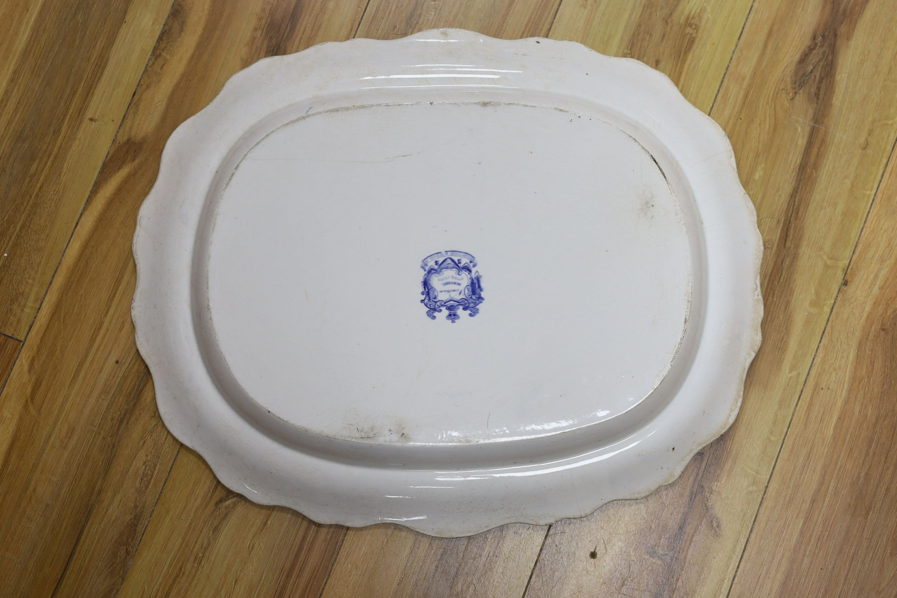 A large Victorian blue-printed stone china meat plate depicting 'Venetian scenery' - 54cm long